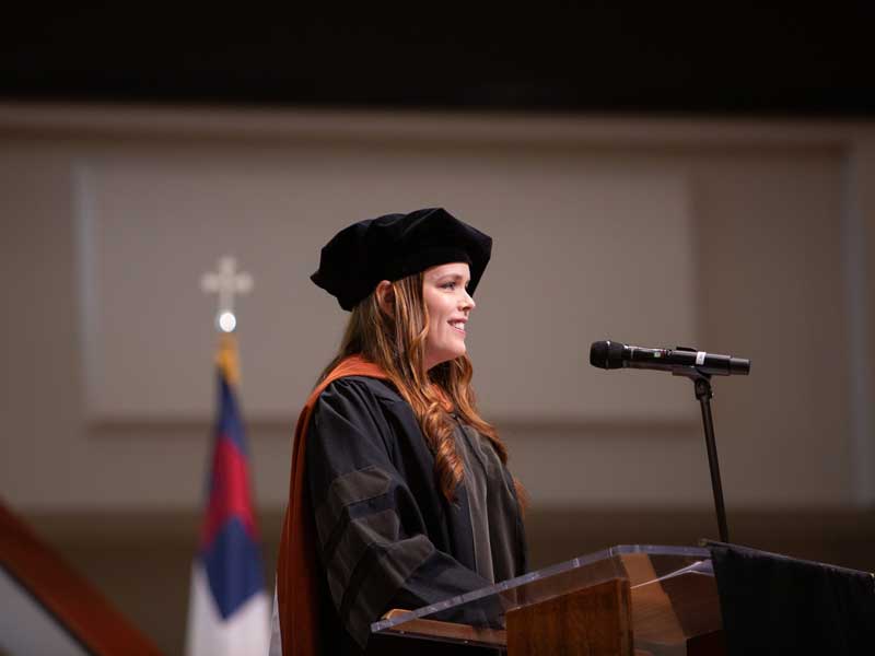 Teacher of the year, Cait Gibson, Pharm.D., addresses the Class of 2025 at the VCU School of Pharmacy Hooding and Diploma Ceremony on May 9, 2025, at St. Paul’s Baptist Church North.