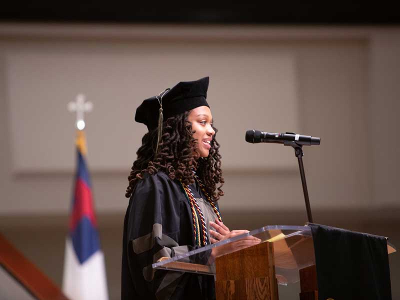 Class of 2025 president Maiya Pencile, Pharm.D., addresses the audience of the VCU School of Pharmacy Hooding and Diploma Ceremony on May 9, 2025, at St. Paul’s Baptist Church North.