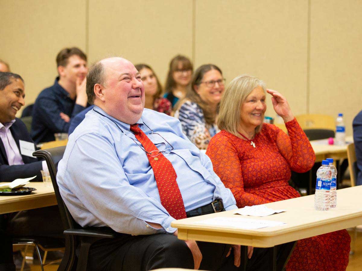 Jurgen Venitz laughs alongside the audience at the VCU School of Pharmacy Research and Career Day in 2019 when the scholarship named for him was announced.